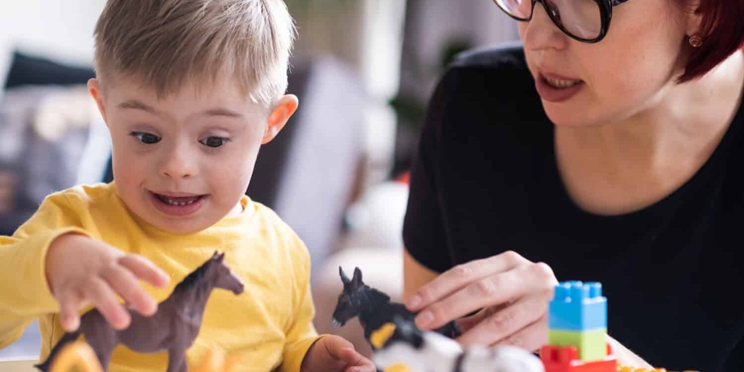 parent bonding with their child with Down syndrome through an educational and stimulating activity, promoting a positive learning experience